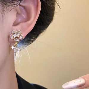 Macro detail of elegant 14k gold plated rose ear clip adorned with sparkling cubic zirconia