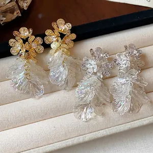 Luxurious 18k gold plated zircon flower tassel drop earrings displayed in a velvet jewelry tray
