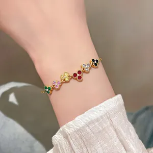 Close-up of a vintage French-style zircon flower bracelet with colorful petals on wrist