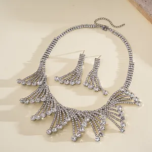 Detailed view of rhinestone-encrusted hollow lace necklace and earring jewelry set