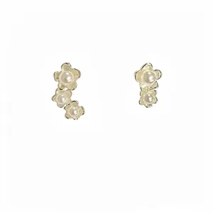 French vintage style gold flower earrings with asymmetric pearls for elegant women