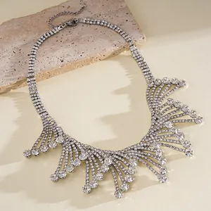 Elegant silver rhinestone fringe necklace with hollow lace design for evening wear