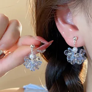 Charming blue translucent flower earrings with a delicate pearl on silver post