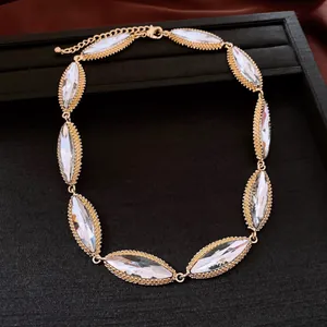 Detailed view of vintage luxury necklace with marquise clear crystals in gold setting