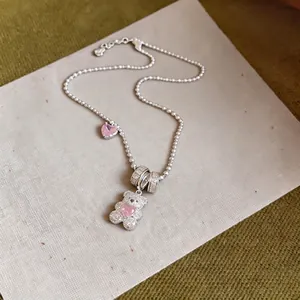 Exquisite silver-tone necklace with zircon-encrusted bear and pink heart pendant