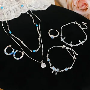 Elegant silver jewelry set including double-layer necklace, bracelet, and earrings
