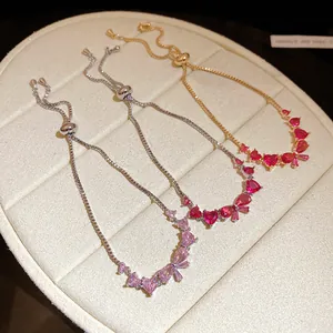 Elegant adjustable zircon bracelets with heart and bow charms in gold and silver finishes