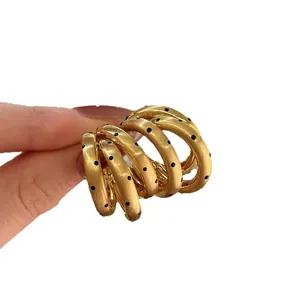 Elegant gold multi-layer C-shape hoop earrings with stylish black polka dots for women