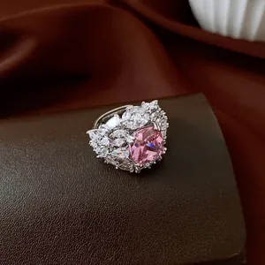 Detailed macro view of a luxury ring featuring a large pink square-cut zircon stone.