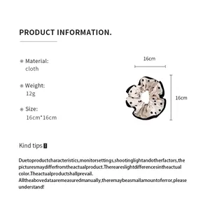 Detailed product specifications for vintage polka dot scrunchie with size and material