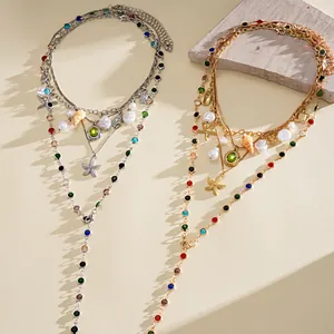 Detail of bohemian layered necklaces with colorful resin beads and starfish charms