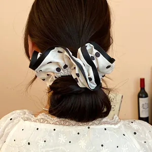 French style polka dot oversized scrunchie for elegant bun hair styling.