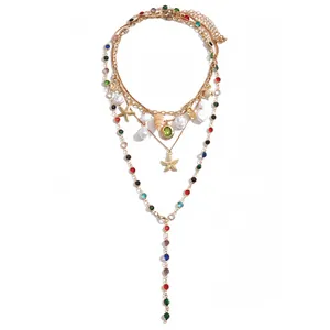 Multi-layer beach necklace with pearls, starfish, seashell charms and colorful resins.