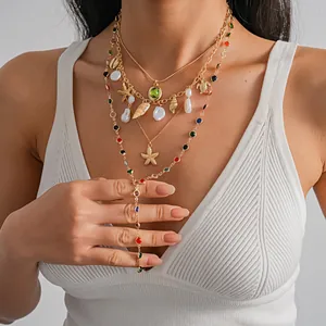 Detailed view of bohemian layered necklace with sea star, shells, and colorful crystals