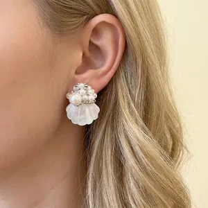 Exquisite beaded shell stud earrings with iridescent finish and pearl accents