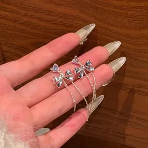 Elegant silver bowknot tassel earrings featuring sparkling heart zircon accents