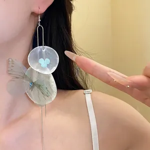 Ethereal chiffon butterfly and shell petal earrings with long silver tassels for women.