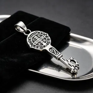 Close-up of vintage Saint Benedict key pendant in antique silver stainless steel