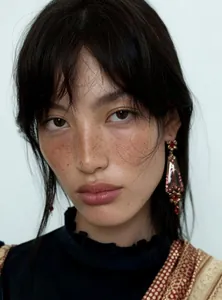 Close-up detail of vintage resin flower earrings in European court style worn by a model
