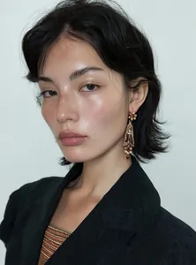 Elegant Asian model wearing vintage resin flower drop earrings with palace style design.