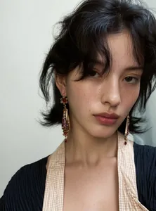 Elegant vintage resin flower drop earrings worn by a model with a palace style look