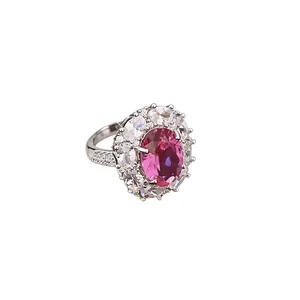 Elegant silver-toned cocktail ring featuring a large pink oval cubic zirconia flower halo