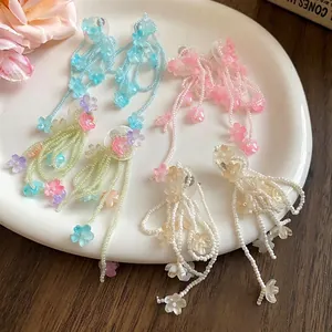 Romantic shell flower tassel earrings in blue, pink, and white for vacation style