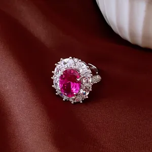 Macro detail showing an elegant vintage oval pink zircon flower open ring with sparkling stones