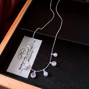 Elegant vintage silver bead necklace featuring white pearls and colorful crystal pendants