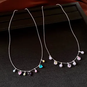 Elegant retro necklaces featuring multi-colored heart charms and delicate faux pearls