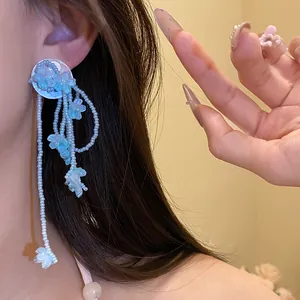 Exquisite handmade blue shell flower tassel earrings with delicate white seed beads