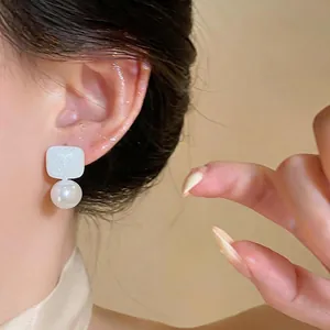 Elegant French style minimalist white geometric earrings with a glossy pearl drop