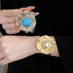 Vintage textured gold cuff bracelet with pearl and turquoise stone accent for women