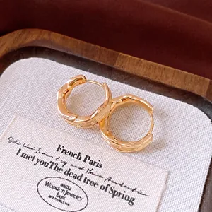 Elegant 18k gold plated pleated hoop earrings with a vintage textured finish for women.