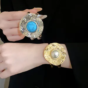 Hammered metal gold cuff bracelet and ring with turquoise and pearl detail