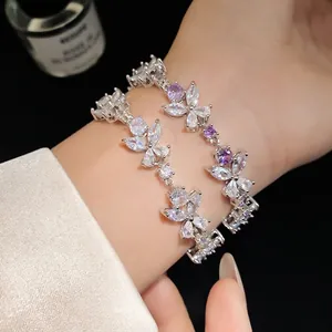 Elegant French-style flower bracelet with sparkling white and purple cubic zirconia stones