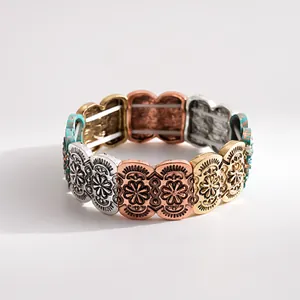 Detail shot of vintage multi-color metallic elastic bracelet with intricate floral carvings