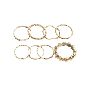 8pcs minimalist gold-toned geometric ring set featuring twisted and textured designs