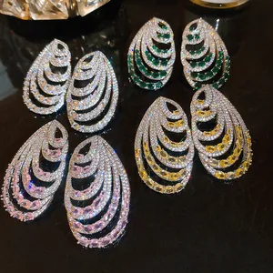 Elegant multi-layer spiral earrings featuring vibrant cubic zirconia in four colors