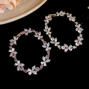 Detailed macro view of elegant zircon flower bracelets with sparkling marquise stones.