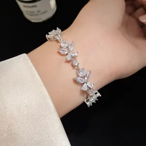 Close-up of French style flower bracelet with sparkling cubic zirconia on wrist