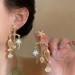Exquisite tropical vacation style earrings with gold fish and palm tree drip oil pendants