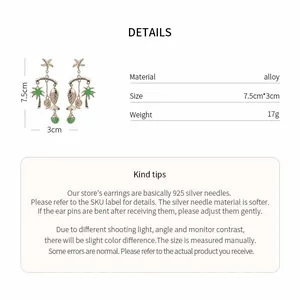 Detailed view of tropical fish and palm tree pendant earrings with size specifications.