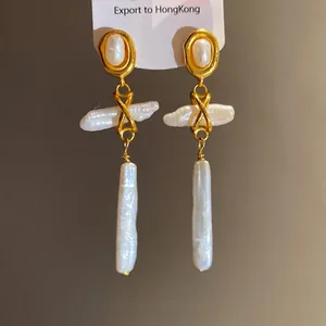 Vintage freshwater pearl drop earrings with elegant oval stud and gold-plated finish.