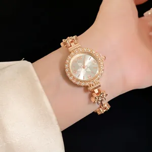 Elegante Damen Quarz-Armbanduhr mit glitzernder Strass-Lünette und Blumen-Armband
