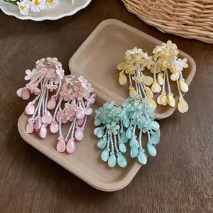 Handmade colorful flower tassel earrings in pink, yellow, and blue dopamine style