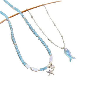 Sea salt style blue beaded necklace set with small fish and starfish pendants for women