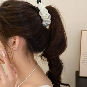 Elegant cream satin banana clip hair accessory for high ponytail styling and decoration
