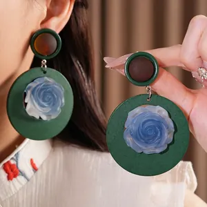 Vintage ethnic style resin floral earrings with oversized green round hoops and silver needles