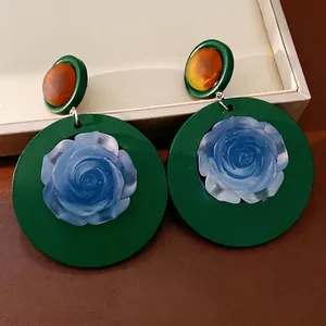 Retro dark green circular resin earrings featuring blue rose center and amber studs